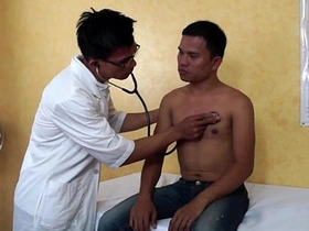 Young Thai doctor has his cock sucked by a twink in a hospital room.