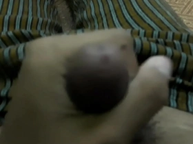 A solo boy from an Asian country masturbating.