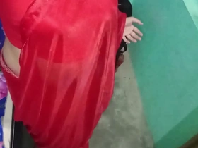 Gaurisissy, the Indian crossdresser in a red saree.
