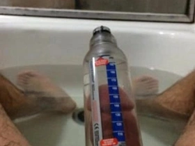 Solo boy tries out Bathmate to improve his penis size