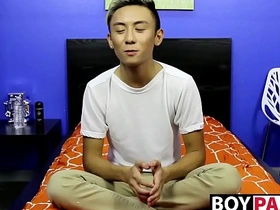Young Asian man undresses and pleasures himself following a conversation