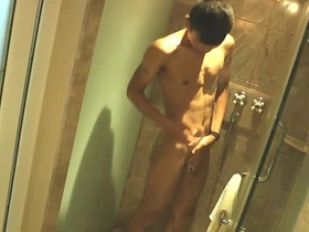 Asian twink soaps up in the shower