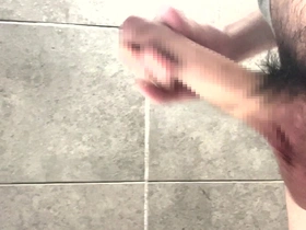 A young Japanese man pleases himself with his impressive member