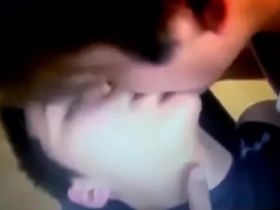 Sensual Asian men engage in passionate lip and ear licking